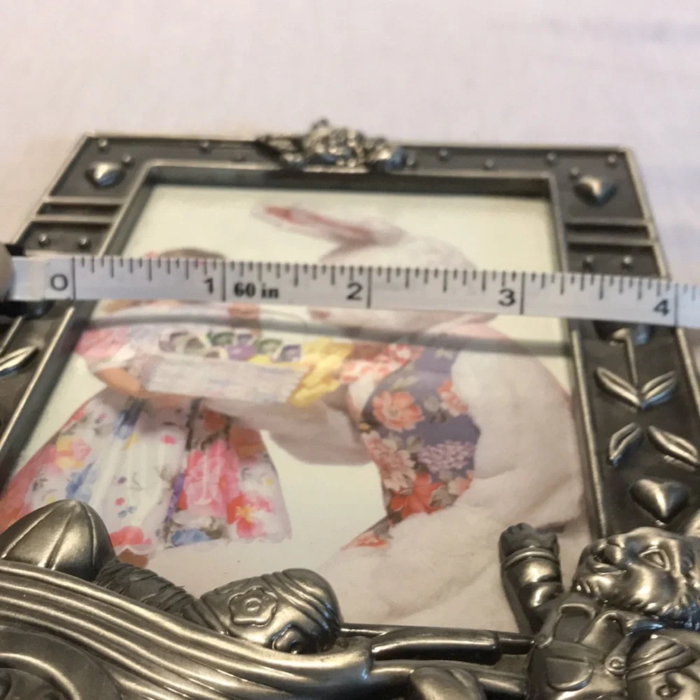 Silver metal rabbit with wheel barrel of eggs picture frame.